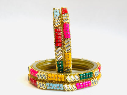 Beautiful set of four multi-colored bangles with modern crystal design.