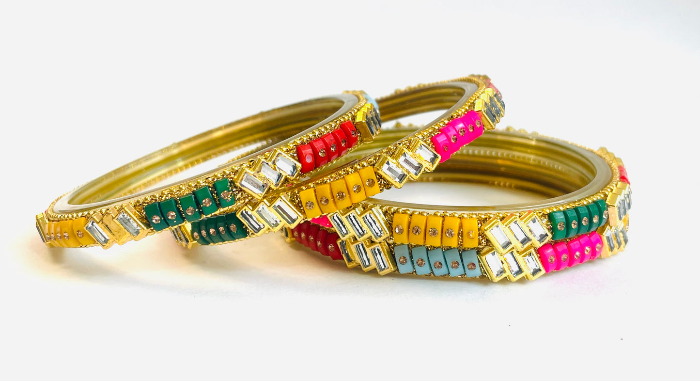 Beautiful set of four multi-colored bangles with modern crystal design.